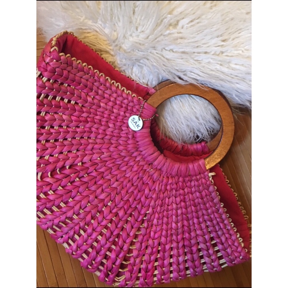 The Sak basket weave bag with wooden handles.
